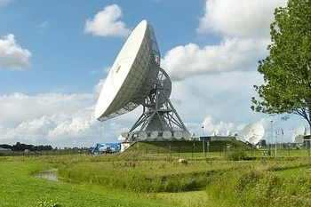 Satellite dish in a meadow