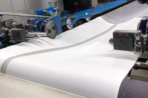 Processing of a spacer fabric from project partner Pressless GmbH with integrated electronics 