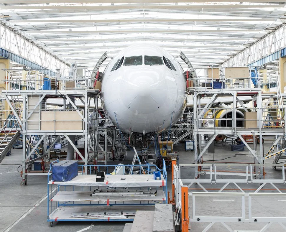 A view inside the hangar at Elbe Flugzeugwerke GmbH (EFW) in Dresden (aircraft viewed from the front during the retrofit process)